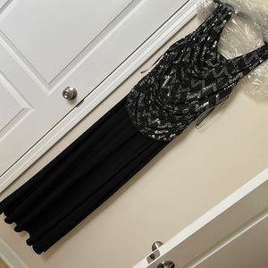 Brand new evening gown new with tags. Black and silver